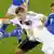 Kein Durchkommen: Wie Lukas Podolski hier gegen Veli Lampi tat sich die deutsche Elf schwer gegen Finnland (Foto: AP)