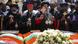 Church leaders pray next to caskets draped in the Ethiopian flags Church leaders pray next to caskets draped in the Ethiopian flags