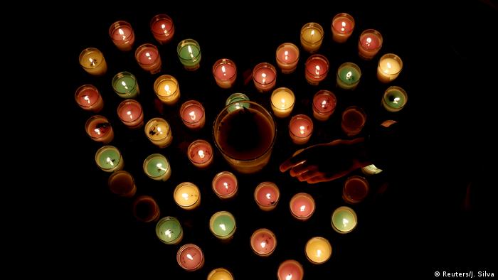 Memorial of candles in the shape of a heart for victims of the New Zealand mosque shootings