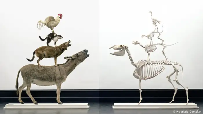 two sculptures showing four animals standing on each other's back, one in the flesh, the other showing only skeletal remains (Maurizio Cattelan)