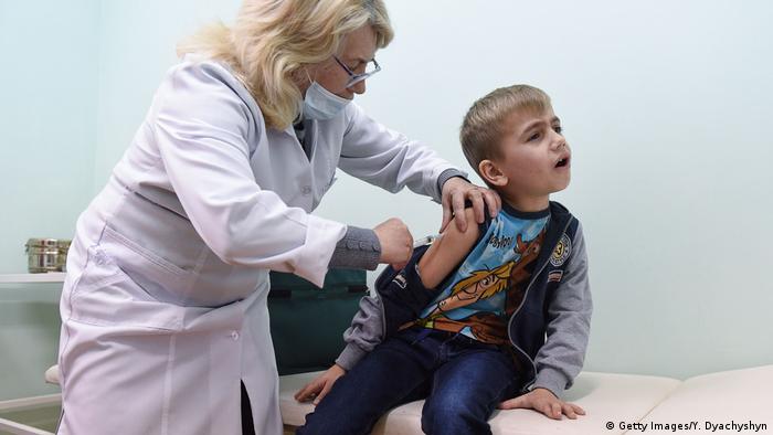 Boy getting measles vaccination in Ukraine