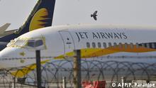 Jet Airways aircraft are seen parked on the tarmac at Chattrapati Shivaji International Airport in Mumbai on March 25, 2019. - India's troubled Jet Airways said on March 25 that founder Naresh Goyal has stepped down as chairman and left the company board as part of a rescue plan. (Photo by PUNIT PARANJPE / AFP)