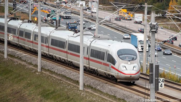 Electric train next to the Autobahn
