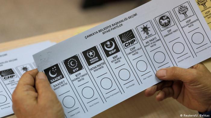 An official checks ballot papers during local elections in Ankara, Turkey