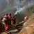 Вогнеборці під час гасіння лісової пожежі у Китаї (фото з архіву)
