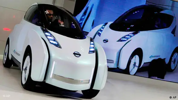 Nissan Motor Co. Chief Executive Carlos Ghosn drives its Land Glider electric vehicle at the 41st Tokyo Motor Show at Makuhari Messe in Makuhari near Tokyo, Japan, Wednesday, Oct. 21, 2009. (AP Photo/Itsuo Inouye)