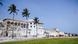 A view of Elmina Castle showing the white outside walls of the fort A view of Elmina Castle showing the white outside walls of the fort