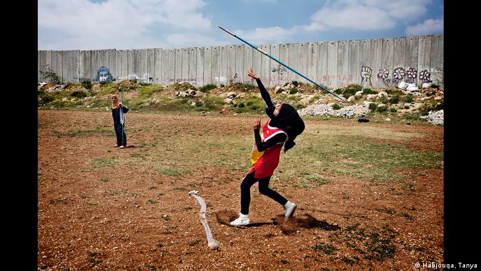 irls play javelin right by the Israeli West Bank barrier (Habjouqa, Tanya)