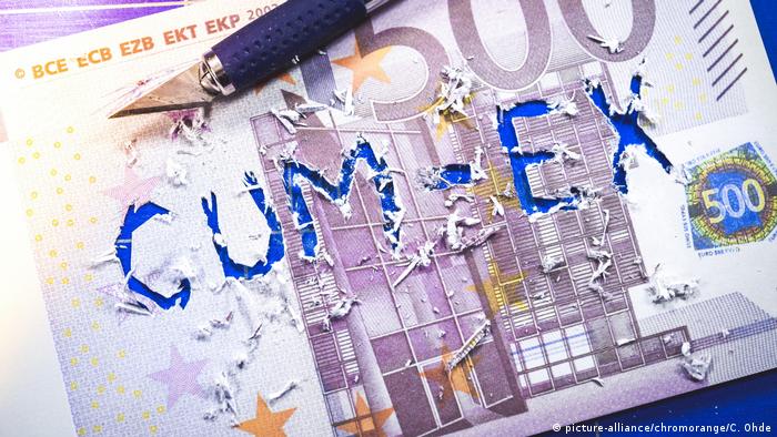 The words cum-ex cut out of a 500 euro bank note
