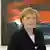 Merkel com um quadro ao fundo