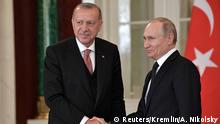 Russian President Vladimir Putin (R) shakes hands with his Turkish counterpart Tayyip Erdogan during a news conference following their talks at the Kremlin in Moscow, Russia April 8, 2019. Sputnik/Alexei Nikolsky/Kremlin via REUTERS ATTENTION EDITORS - THIS IMAGE WAS PROVIDED BY A THIRD PARTY.