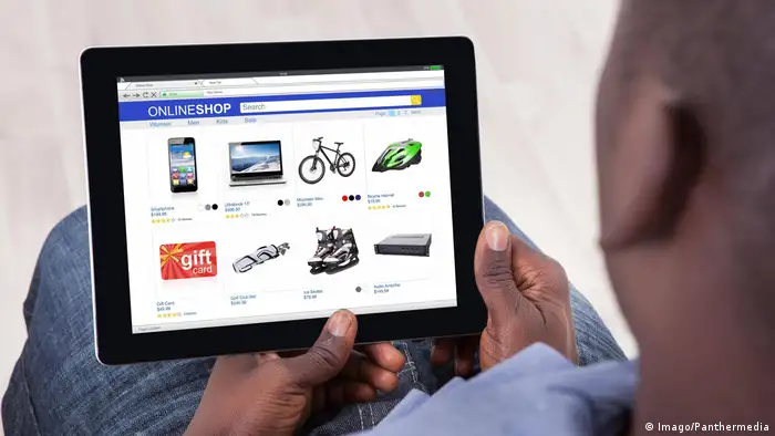 A man doing online shopping on his tablet