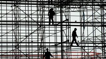 Scaffold with three workers Scaffold with three workers