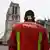A firefighter in front of Notre Dame