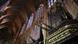 The pipes of the Leon cathedral jut out among stained-glass windows The pipes of the Leon cathedral jut out among stained-glass windows