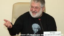 Governor of Dnipropetrovsk region Igor Kolomoisky dressed in UN Agency for refugees shirts with the portrait of a distinguished physicist Albert Einstein, who became a refugee from Nazi Germany in the United States to save his life, and slogan 'Einstein was a refugee' in Dnipropetrovsk, Ukraine October 24, 2014. This day Memorandum was signed between the UN and Dnipropetrovsk regional state administration on allocation 2 million USD for the benefit of refugees from Crimea and Eastern Ukraine into Dnipropetrovsk region. Photo given by press service of the Dnipropetrovsk regional state administration / DYVYS / FOR NON-COMMERCIAL USE ONLY | Verwendung weltweit