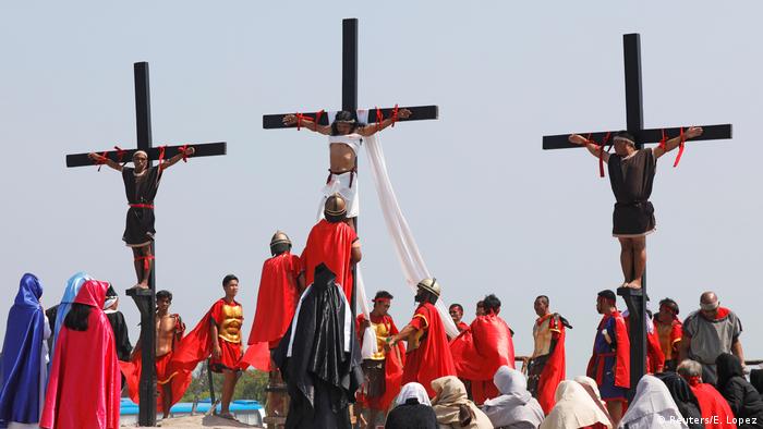 Three men nailed to the cross as part of Good Friday events in the Philippines