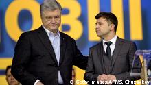 Ukrainian President Petro Poroshenko (L) speaks with presidential candidate Volodymyr Zelensky (R) during a presidential election debate at Olimpiyski stadium in Kiev on April 19, 2019. - A comedian tipped to take over Ukraine's presidency and his incumbent rival went head-to-head in a bitter stadium debate on April 19, as campaigning reached its grand finale before a weekend vote. Polls show Volodymyr Zelensky, a 41-year-old standup comic with no political experience, handily defeating President Petro Poroshenko in a second-round of voting on April 21. (Photo by Sergei CHUZAVKOV / AFP) (Photo credit should read SERGEI CHUZAVKOV/AFP/Getty Images)