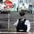 Police secure the area where a journalist was fatally shot amid rioting overnight in the Creggan area of Derry (Londonderry) in Northern Ireland 
