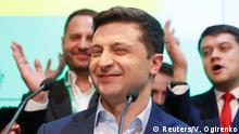 Ukrainian presidential candidate Volodymyr Zelenskiy reacts following the announcement of the first exit poll in a presidential election at his campaign headquarters in Kiev, Ukraine April 21, 2019. REUTERS/Valentyn Ogirenko