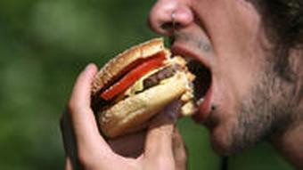 Person eating a hamburger