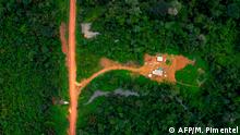 Aerial view of the Arado tribal camp, in Arara indigenous land, located beside the Transamazonica highway (BR-230), between the cities of Uruara and Medicilandia, in Para state, Brazil on March 13, 2019. - According to the NGO Imazon, deforestation in the Amazonia increased in a 54% in January, 2019 -the first month of Brazilian President Jair Bolsonaro's term- compared to the same month of 2018. Para state concentrates the 37% of the devastated areas. (Photo by Mauro Pimentel / AFP)