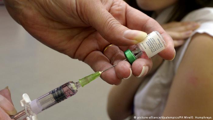 File photo dated 25/04/13 of a measles vaccination being administered