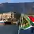 The South African flag with Table Mountain in the background