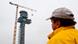 Construction worker in front of BBI control tower Construction worker in front of BBI control tower