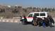 Afghan journalists take cover behind an ambulance Afghan journalists take cover behind an ambulance