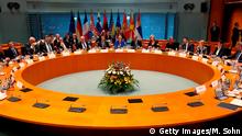 The participants in the West Balkans conference including German Chancellor Angela Merkel and French President Emmanuel Macron take their seats at the chancellery in Berlin on April 29, 2019. - German Chancellor Angela Merkel and French President Emmanuel Macron are hosting the Western Balkans leaders and EU members Croatia and Slovenia hoping to reboot a dialogue between bitter foes Serbia and Kosovo over one of the Balkans' thorniest disputes. (Photo by Michael Sohn / POOL / AFP) (Photo credit should read MICHAEL SOHN/AFP/Getty Images)