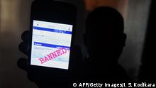 A Sri Lankan man mobile phone user shows an image on Twitter showing that the Facebook site had been blocked in Colombo on March 7, 2018. - Telecommunication service providers said they have blocked access to facebook and several other social media platforms on the directive of the government which accused extremists of using the popular social media to spread hate speech and instigate violence against the Muslim minority in the country. (Photo by ISHARA S. KODIKARA / AFP) (Photo credit should read ISHARA S. KODIKARA/AFP/Getty Images)