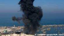 Smoke billows in the area overlooking Gaza City's main port during an Israeli airstrike on the Hamas-run Palestinian enclave on May 5, 2019. - Gaza militants fired fresh rocket barrages at Israel early today in a deadly escalation that has seen Israel respond with waves of strikes as a fragile truce again faltered and a further escalation was feared. (Photo by MOHAMMED ABED / AFP) (Photo credit should read MOHAMMED ABED/AFP/Getty Images)