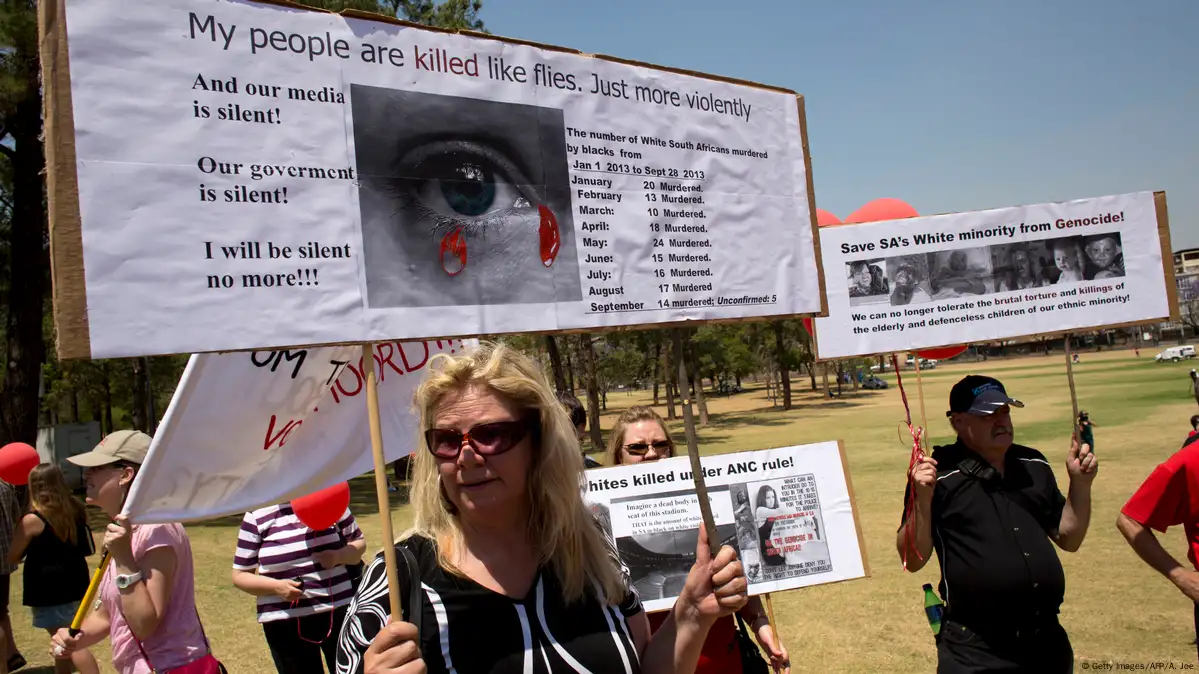 White South African man holds up a flag for the Afrikaner