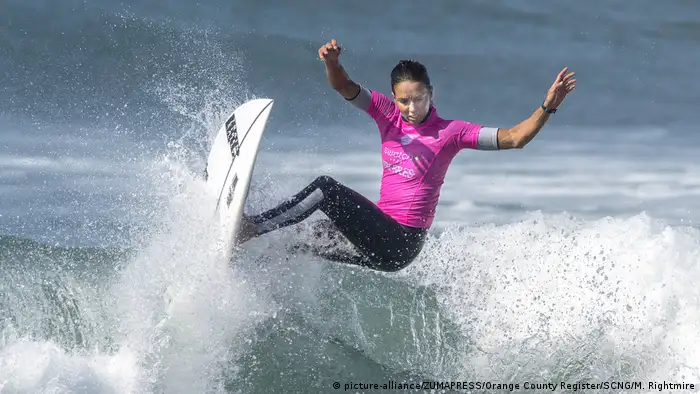 Surfer Sally Fitzgibbons rides a wave during a competition
