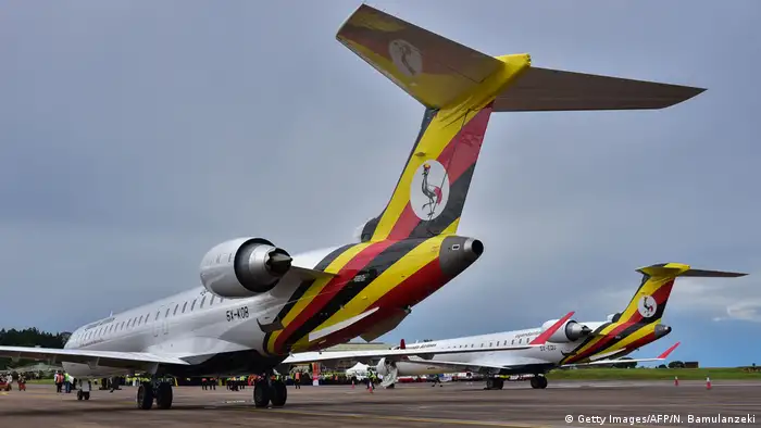 Two bombardier CRJ900 aircraft with the new Uganda Airlines logo on the tail