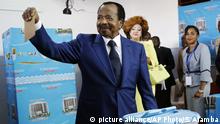 FILE - In this Sunday Oct. 7, 2018, file photo, Cameroon's incumbent President Paul Biya, of the Cameroon People's Democratic Movement party, casts his vote during the presidential elections in Yaounde, Cameroon. The United States says it's cutting military aid to Cameroon over human rights concerns after growing allegations of abuses by security forces. (AP Photo/Sunday Alamba, File) |