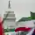 Вид на Белый дом  сквозь иранские флаги