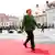 Angela Merkel arriving in Sibiu, walking on a red carpet