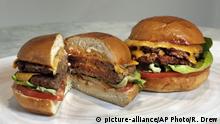 An Original Impossible Burger, left, and a Cali Burger, from Umami Burger, are shown in this photo in New York, Friday, May 3, 2019. A new era of meat alternatives is here, with Beyond Meat becoming the first vegan meat company to go public and Impossible Burger popping up on menus around the country. (AP Photo/Richard Drew) |