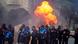 Police officers infront of a petrol bomb explosion in Tirana Police officers infront of a petrol bomb explosion in Tirana