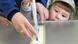 A woman and child cast her ballot during the first round of voting in Lithuania A woman and child cast her ballot during the first round of voting in Lithuania