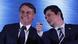 Presidente Jair Bolsonaro e ministro da Justiça Sergio Moro rindo, em evento em Curitiba Presidente Jair Bolsonaro e ministro da Justiça Sergio Moro rindo, em evento em Curitiba