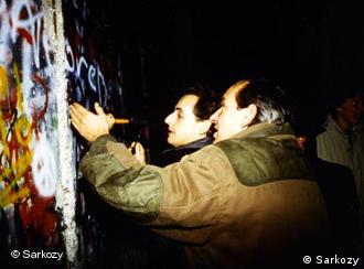 Sarkozy chipping away at the Berlin Wall on November 9, 1989