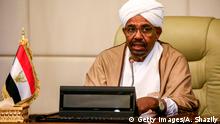 Sudan's President Omar al-Bashir attends a meeting with his new 20-member cabinet as they take oath at the presidential palace in the capital on March 14, 2019. - President Bashir swore in a new cabinet on March 14 to tackle the country's economic crisis that has triggered demonstrations against his rule since December. The new cabinet led by Prime Minister Mohamed Tahir Eila is the third such government formed in less than two years, with the previous two sacked by Bashir for failing to revive the dilapidated economy. (Photo by ASHRAF SHAZLY / AFP) (Photo credit should read ASHRAF SHAZLY/AFP/Getty Images)