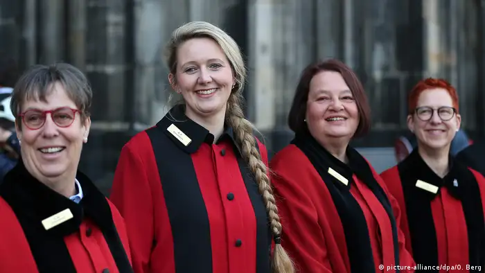 Germany's female stewards in front of the Cologne Cathedral