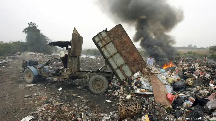 rubbish dump in China, with fire