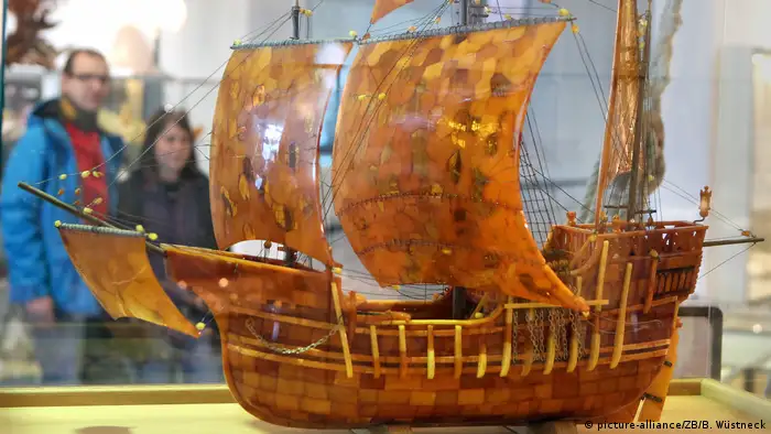Model of a sailng ship made of amber