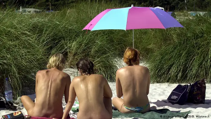 People practicing nudism at the Baltic Sea.