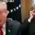 Former national security adviser John Bolton sits behind US President Donald Trump